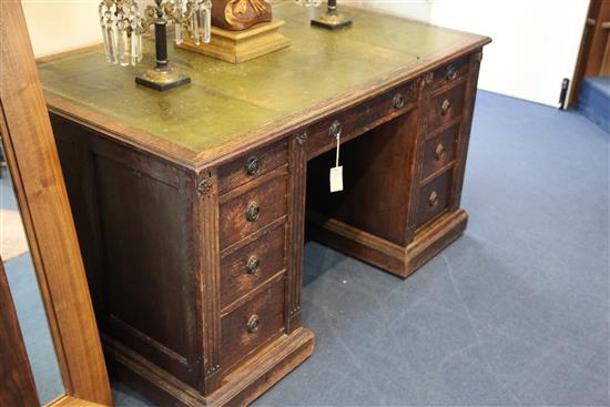 A late Victorian oak desk by Gillow, 3ft x 2ft 6in.